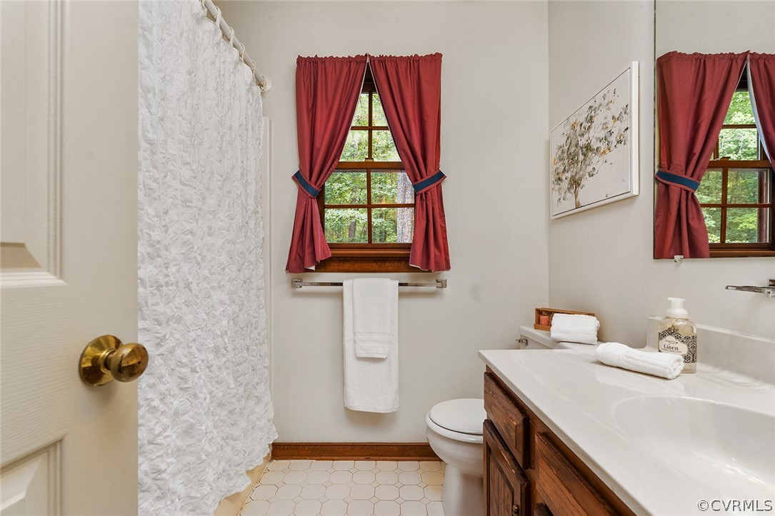 3601 Markey Road Midlothian, VA 23112 - Photo 25 of 33 a bathroom with a sink vanity mirror and toilet