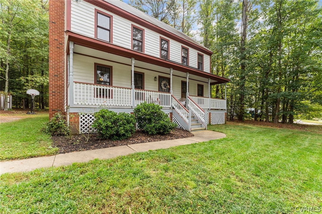 3601 Markey Road Midlothian, VA 23112 - Photo 3 of 33 a front view of a house with a yard and trees