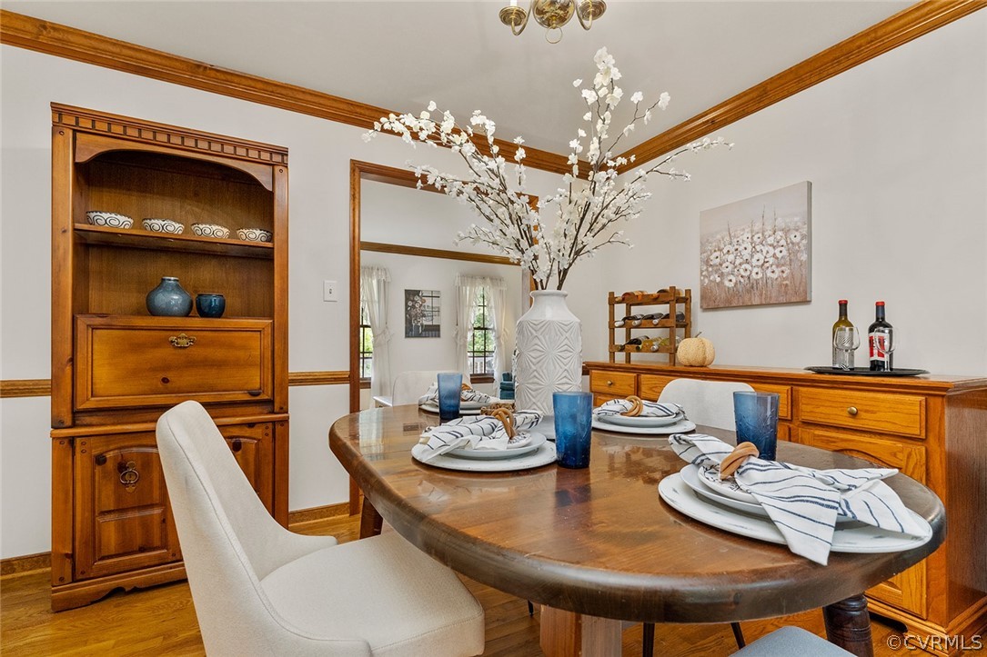 3601 Markey Road Midlothian, VA 23112 - Photo 8 of 33 a view of a dining room with furniture a chandelier and wooden floor