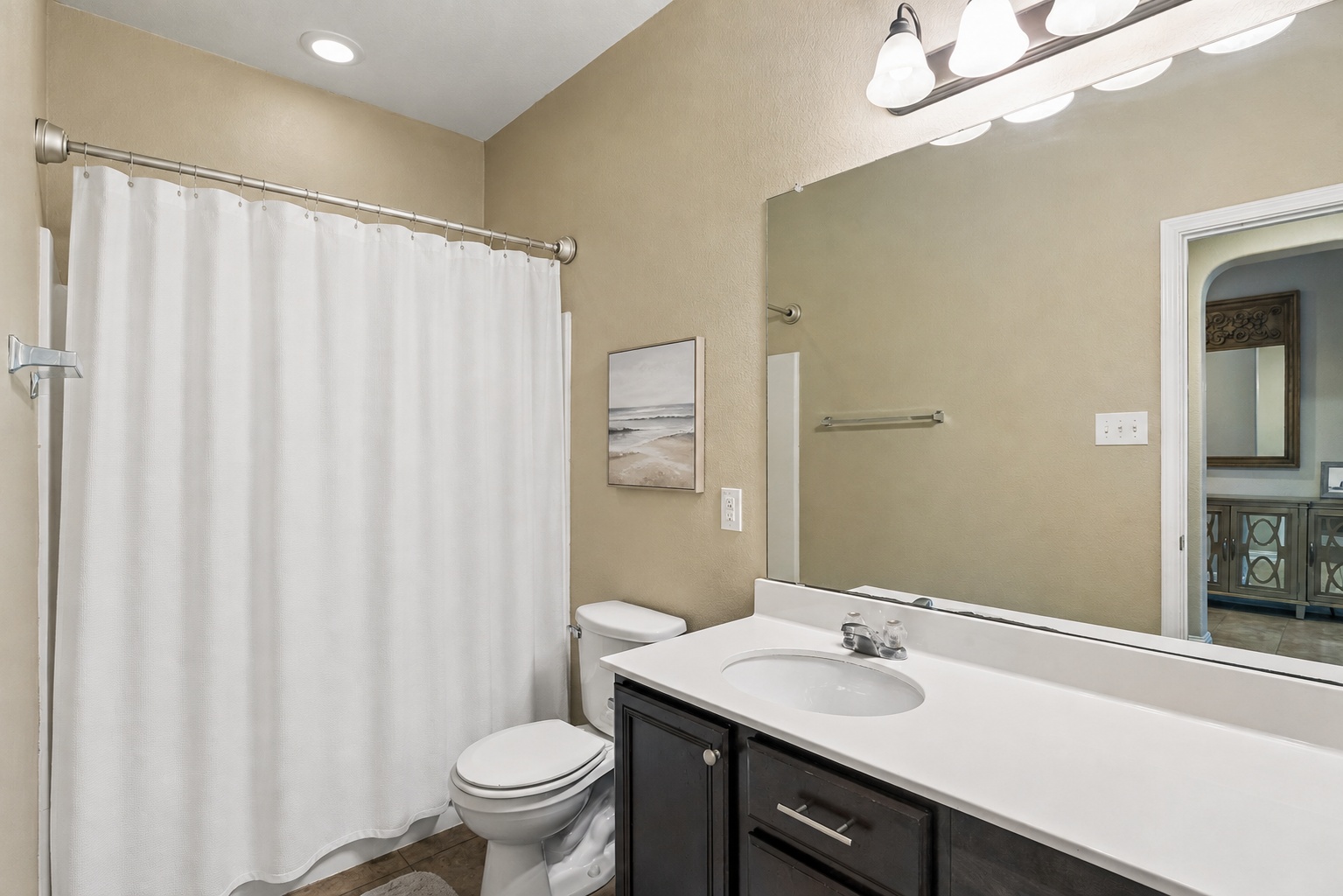 1113 Yellow Iris Road Leander, TX 78641 - Photo 20 of 26 High ceilings and recessed lighting elevate this clean bathroom vanity area.