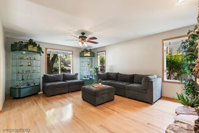 a spacious bedroom with a bed and a large window