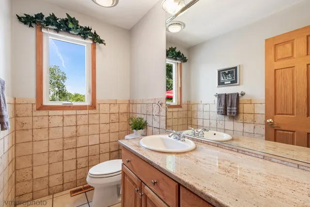 a view of an entryway wooden floor and windows