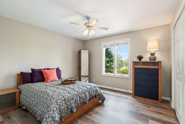 a living room with furniture a rug and a window