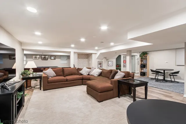 a room with pool table and windows