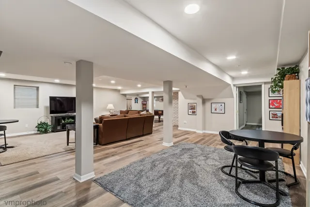 a swimming pool with outdoor seating