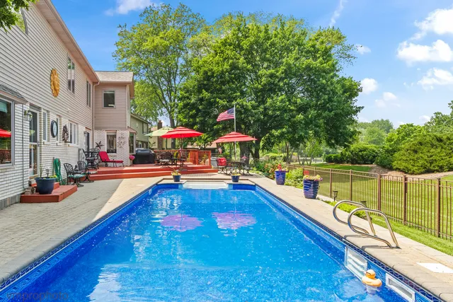 a front view of house with a garden