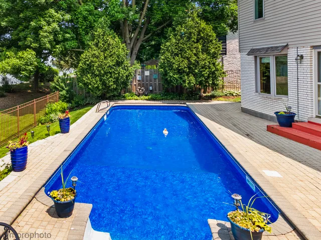 an aerial view of a house with a lake view