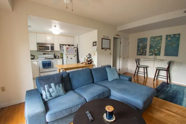 a living room with furniture and a table