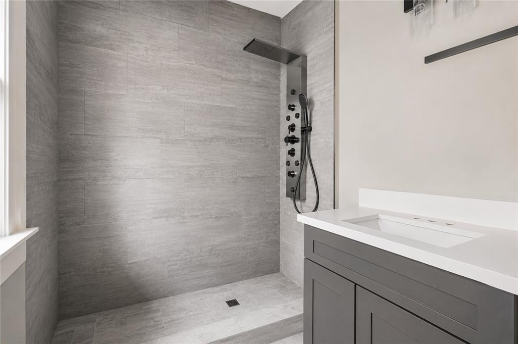 665 Lexington Avenue Southwest Atlanta, GA 30310 - Photo 12 of 33 a bathroom with a shower and a sink