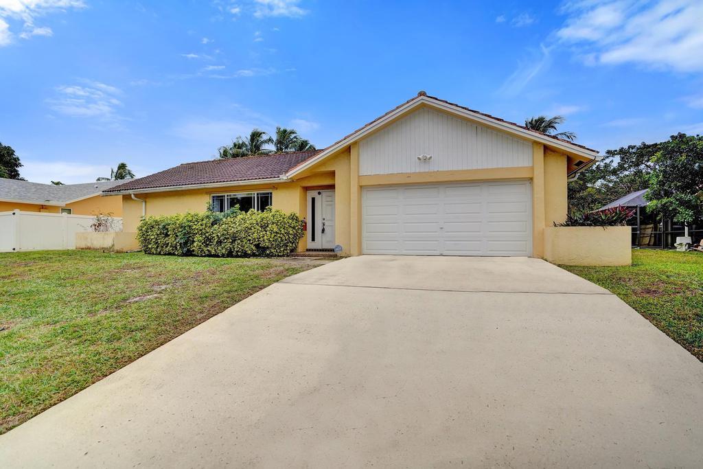 1236 Northwest 15th Street Boca Raton, FL 33486 - Photo 2 of 58 a front view of house with yard