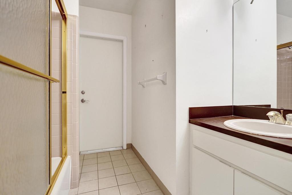 1236 Northwest 15th Street Boca Raton, FL 33486 - Photo 37 of 58 a bathroom with a sink and a mirror