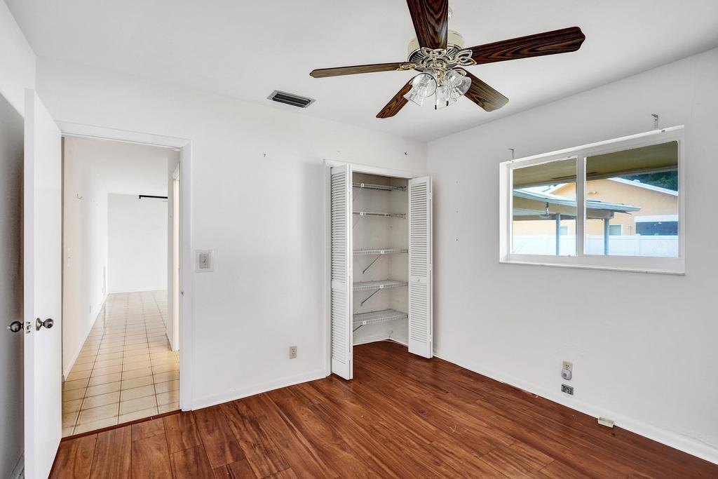1236 Northwest 15th Street Boca Raton, FL 33486 - Photo 42 of 58 wooden floor in an empty room with a window