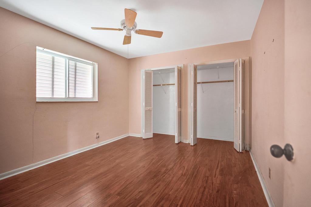 1236 Northwest 15th Street Boca Raton, FL 33486 - Photo 45 of 58 wooden floor in an empty room with a window