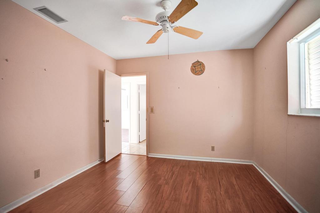 1236 Northwest 15th Street Boca Raton, FL 33486 - Photo 46 of 58 an empty room with wooden floor and windows