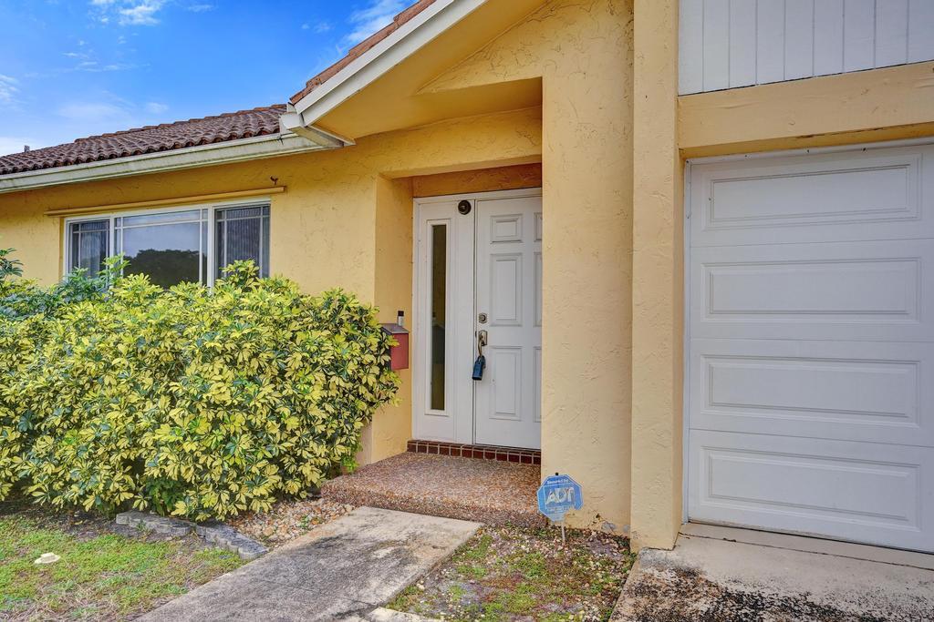 1236 Northwest 15th Street Boca Raton, FL 33486 - Photo 5 of 58 a view of front door of house