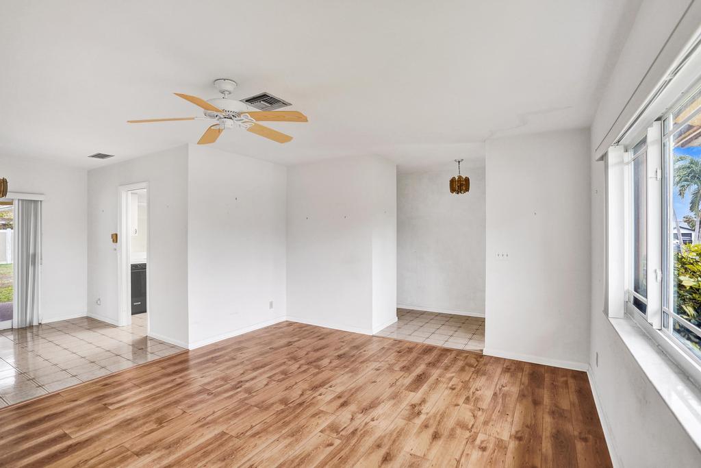 1236 Northwest 15th Street Boca Raton, FL 33486 - Photo 9 of 58 a view of empty room with wooden floor and fan