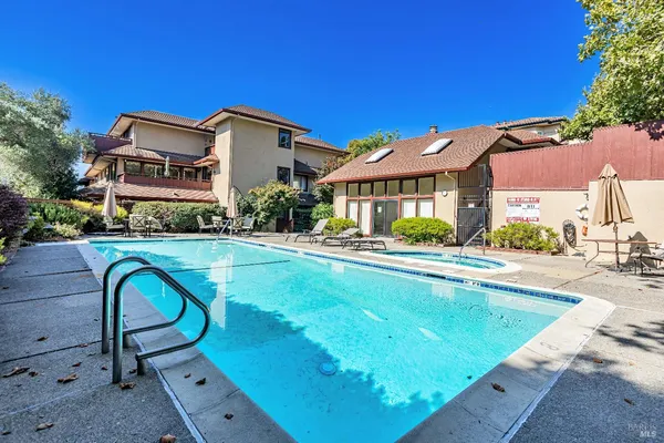 a view of a house with swimming pool