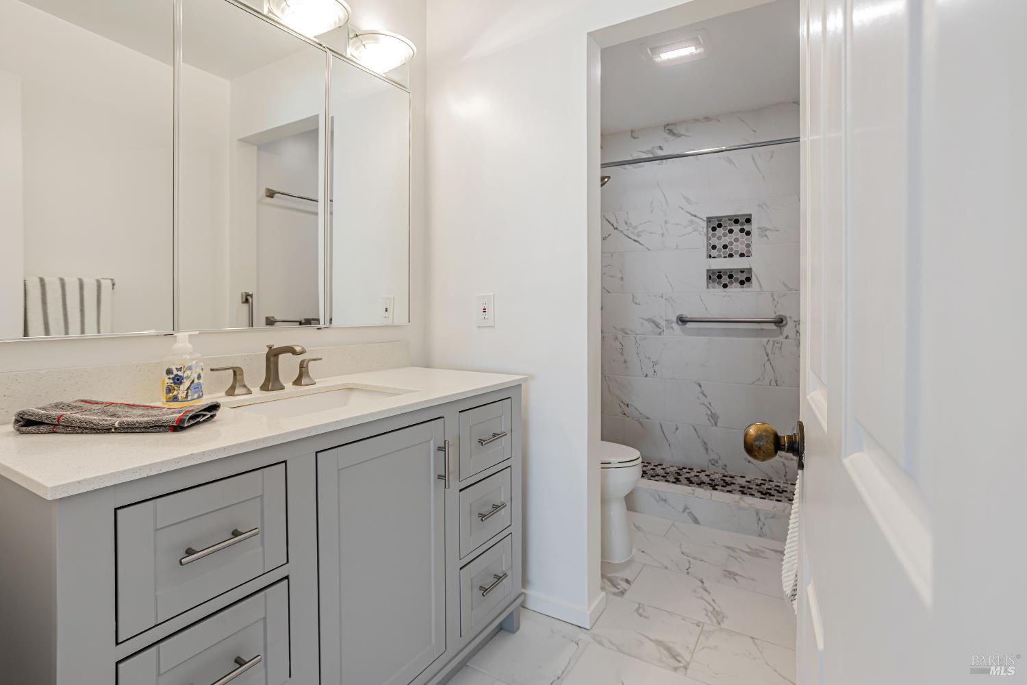 820 Mission Avenue, Unit 7 San Rafael, CA 94901 - Photo 19 of 33 a bathroom with a granite countertop sink mirror and toilet