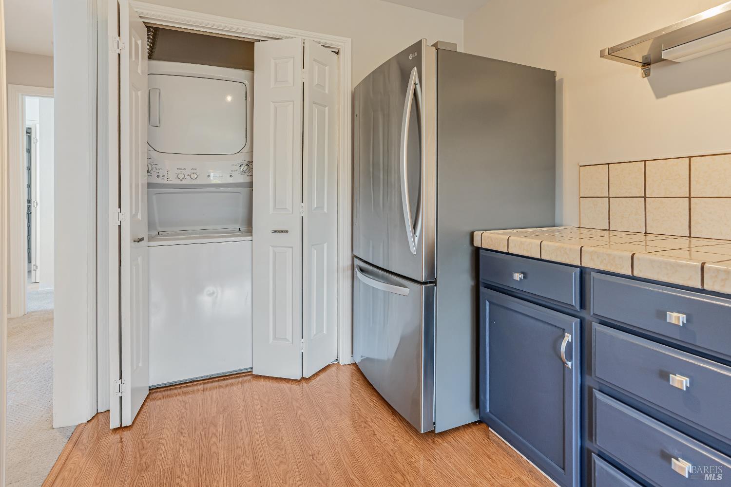 820 Mission Avenue, Unit 7 San Rafael, CA 94901 - Photo 21 of 33 a kitchen with a refrigerator and cabinets