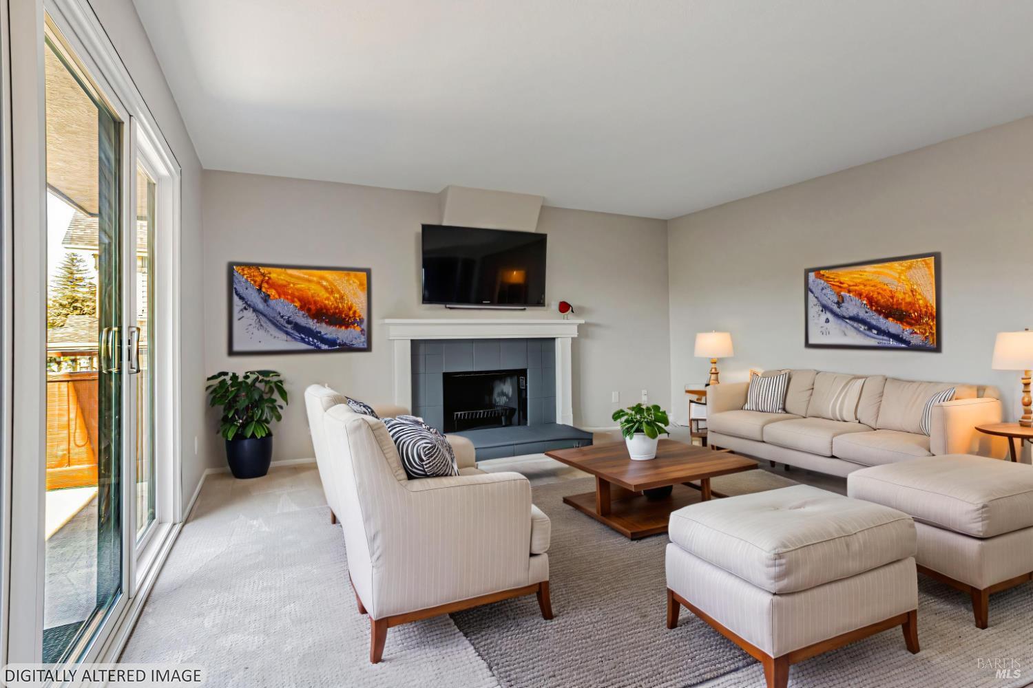 820 Mission Avenue, Unit 7 San Rafael, CA 94901 - Photo 5 of 33 a living room with furniture a flat screen tv and a fireplace