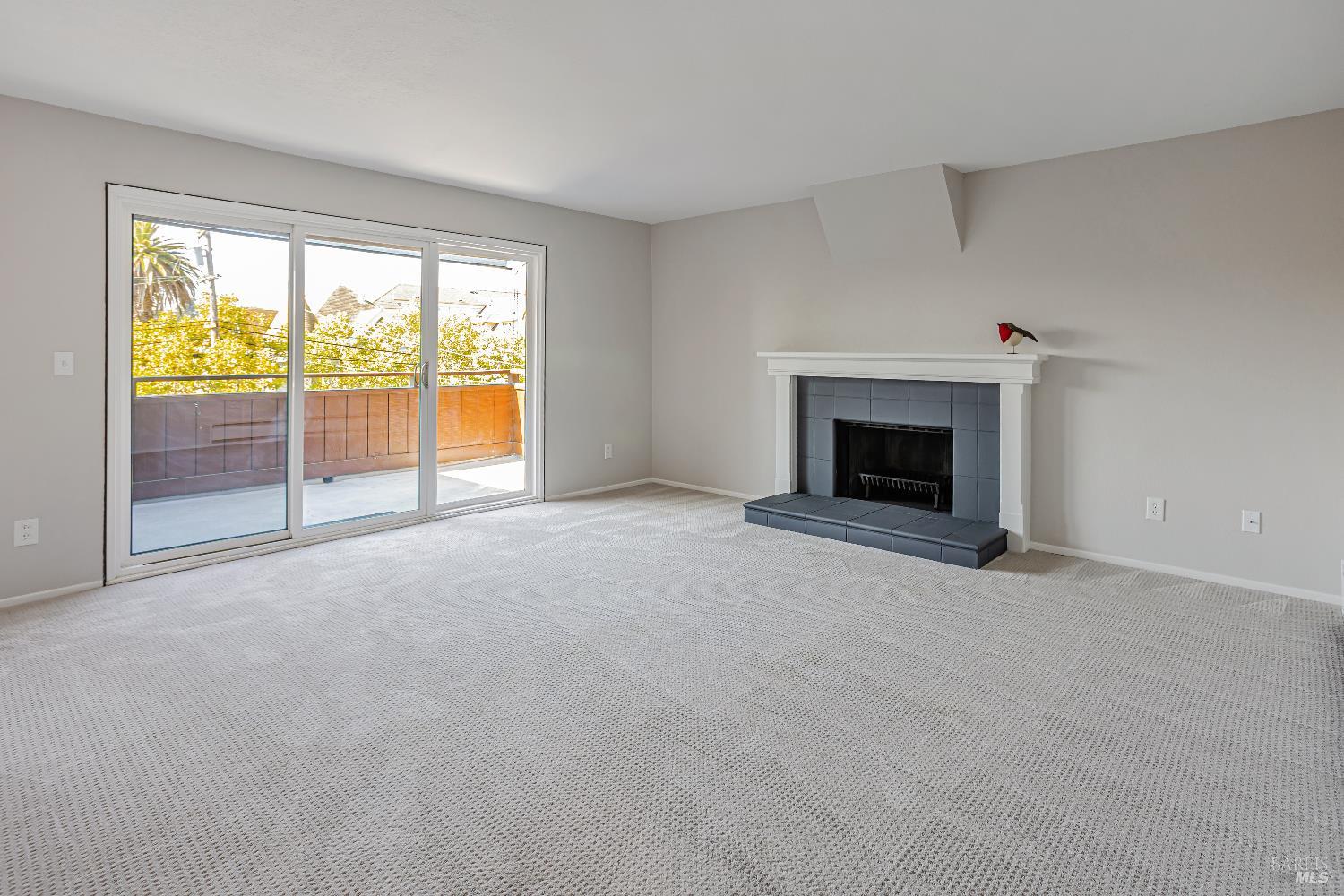 820 Mission Avenue, Unit 7 San Rafael, CA 94901 - Photo 6 of 34 wooden floor fireplace and windows in an empty room