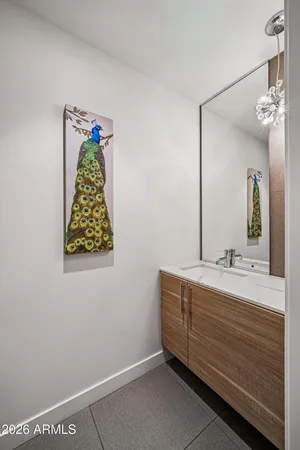 a living room with furniture a flat screen tv and a floor to ceiling window