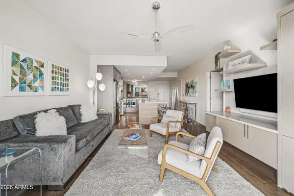 a living room with furniture and a flat screen tv