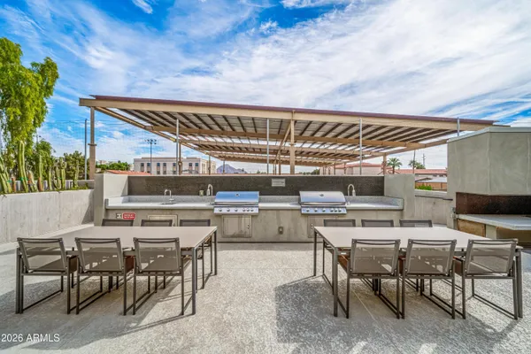 a view of a dining room with furniture and a floor to ceiling window