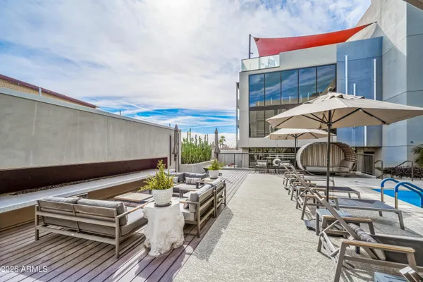 a view of a chairs and table in a patio