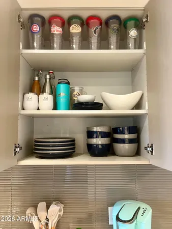 a stove top oven sitting inside of a kitchen