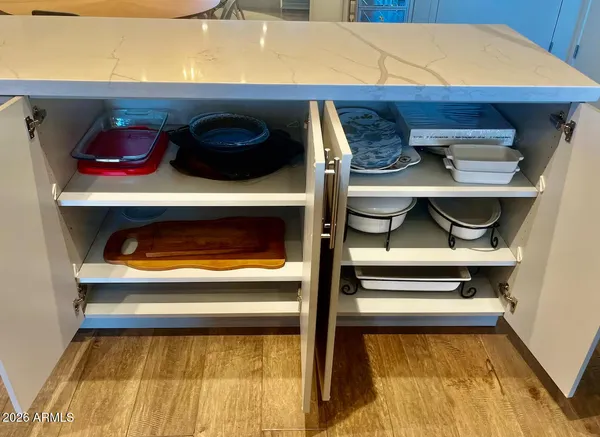 a close view of walk in closet and wooden floor