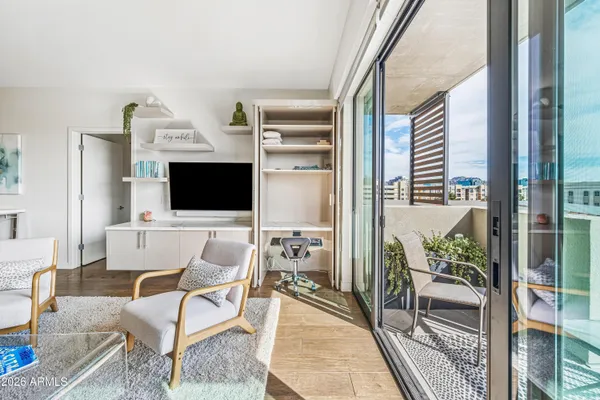 a large kitchen with stainless steel appliances kitchen island a large counter top and a refrigerator