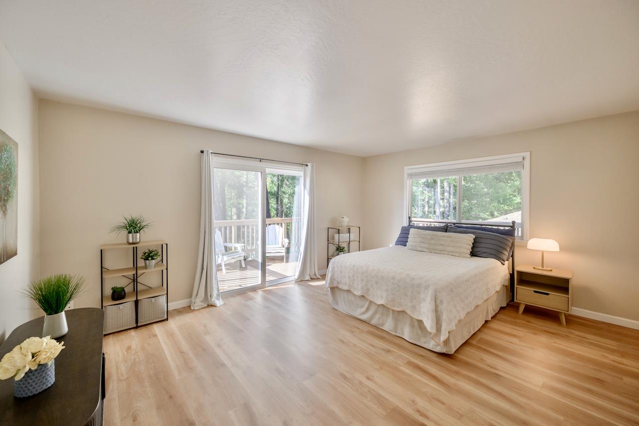 155 Rabbits Run Road Santa Cruz, CA 95060 - Photo 64 of 113 a bedroom with a bed and wooden floor