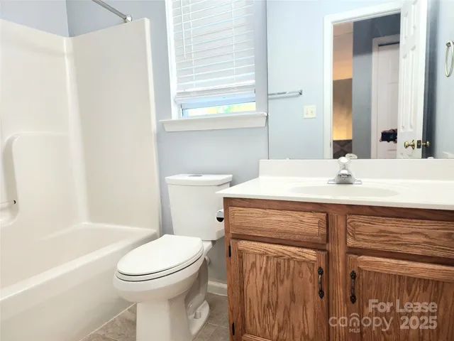 a bathroom with a sink a toilet and a bathtub
