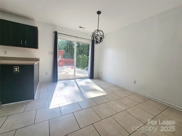 a view of entryway with kitchen
