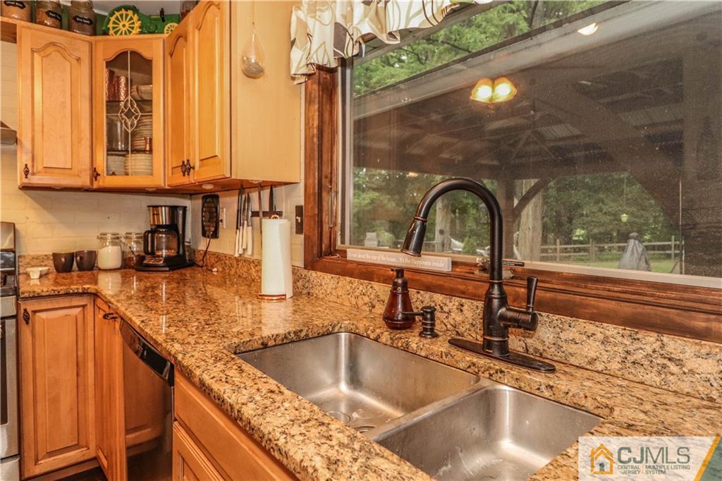 31 Silvers Road Freehold, NJ 07728 - Photo 14 of 46 a kitchen with a sink and a large window