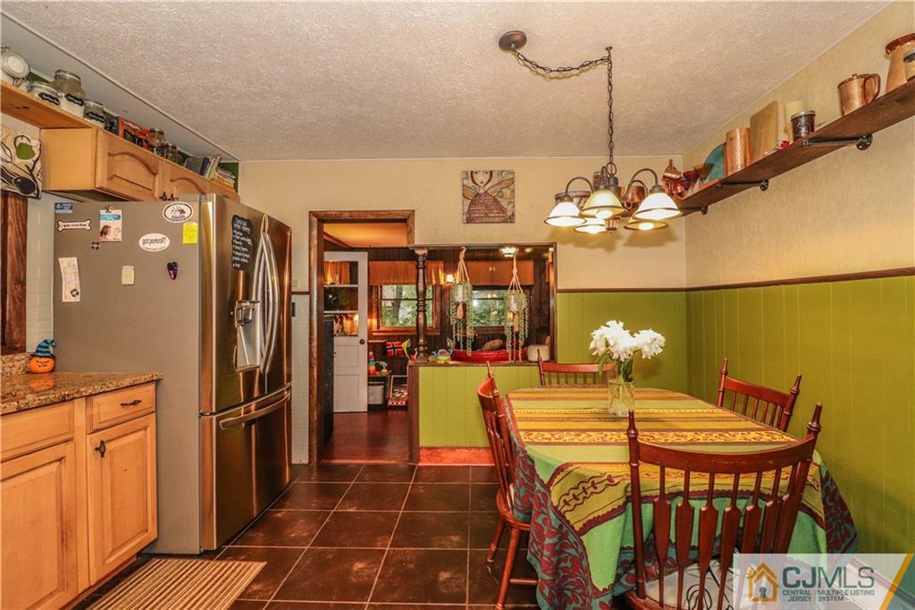 31 Silvers Road Freehold, NJ 07728 - Photo 17 of 46 a view of a dining room with furniture and chandelier