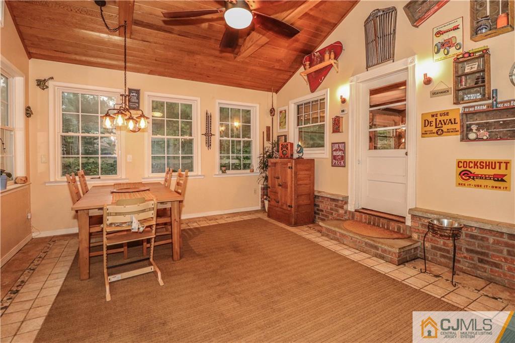 31 Silvers Road Freehold, NJ 07728 - Photo 19 of 46 a dining room with a wooden table and chairs