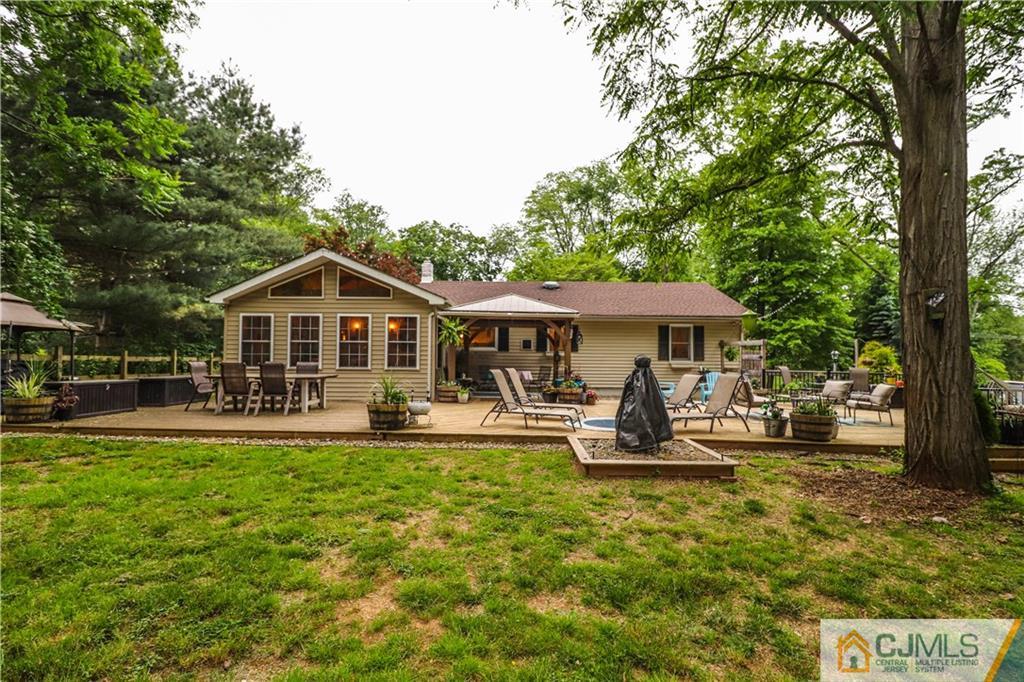 31 Silvers Road Freehold, NJ 07728 - Photo 3 of 46 a front view of a house with swimming pool and sitting area