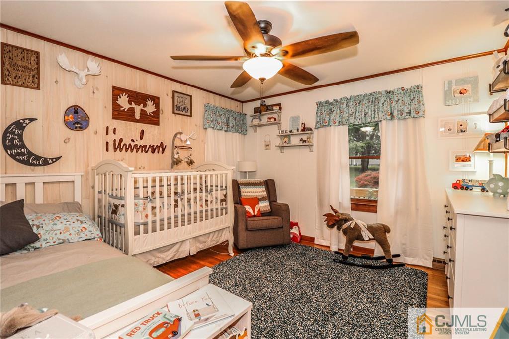 31 Silvers Road Freehold, NJ 07728 - Photo 25 of 46 a bedroom with furniture and a large window