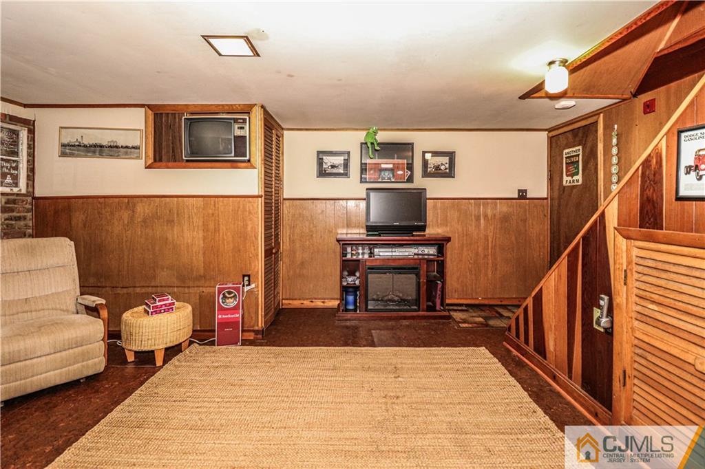 31 Silvers Road Freehold, NJ 07728 - Photo 28 of 46 a living room with furniture and a piano