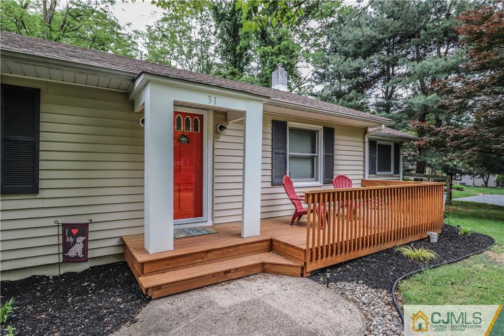 31 Silvers Road Freehold, NJ 07728 - Photo 4 of 46 a view of a house with a yard and deck