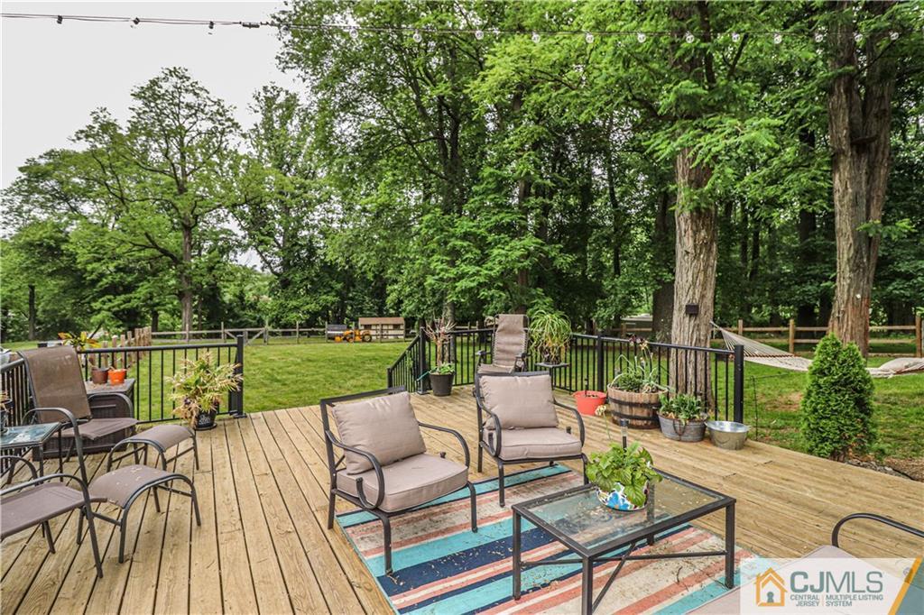 31 Silvers Road Freehold, NJ 07728 - Photo 36 of 46 a view of house with patio outdoor seating and city view
