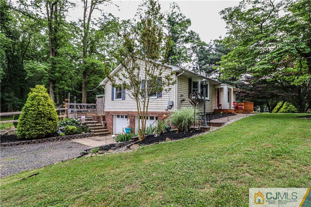 31 Silvers Road Freehold, NJ 07728 - Photo 5 of 46 a front view of a house with garden