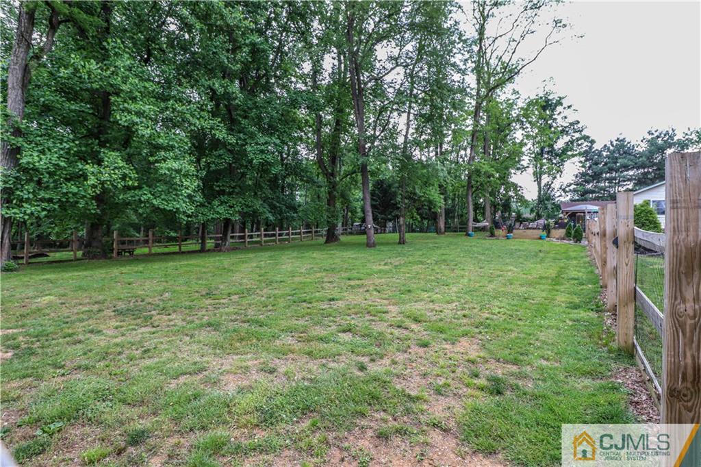 31 Silvers Road Freehold, NJ 07728 - Photo 42 of 46 a view of a grassy field with trees in the background