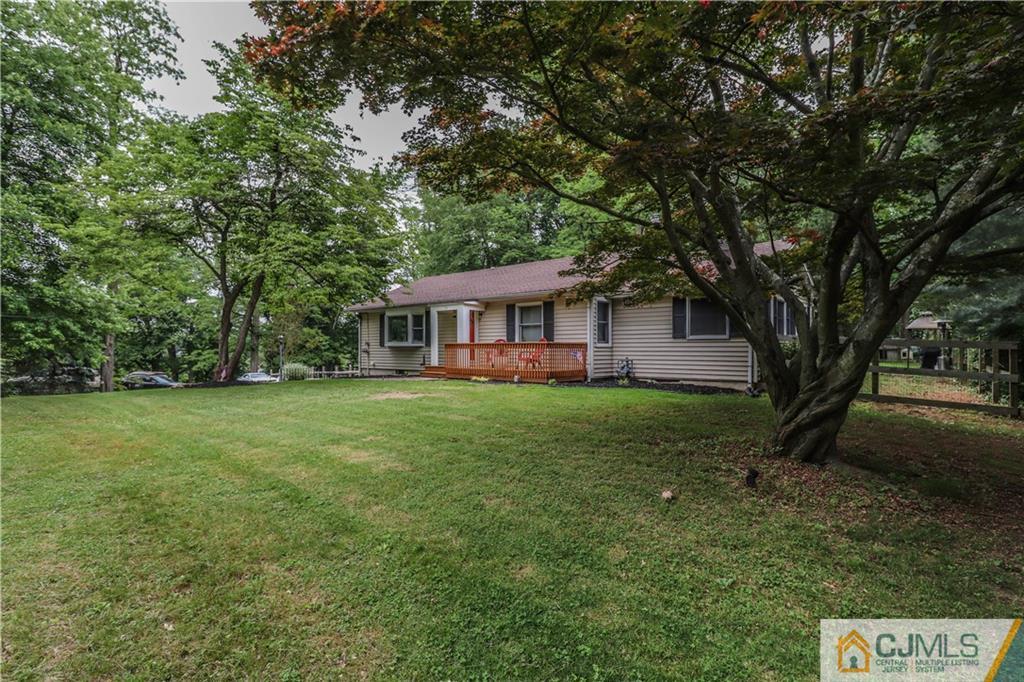31 Silvers Road Freehold, NJ 07728 - Photo 6 of 46 a front view of a house with a yard and trees