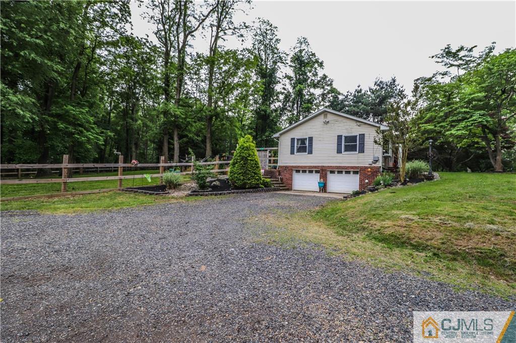 31 Silvers Road Freehold, NJ 07728 - Photo 7 of 46 a view of a house with a yard and a fountain