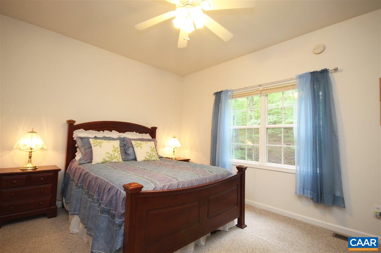 11 Zephyr Road Palmyra, VA 22963 - Photo 12 of 21 a bedroom with a large bed and a window