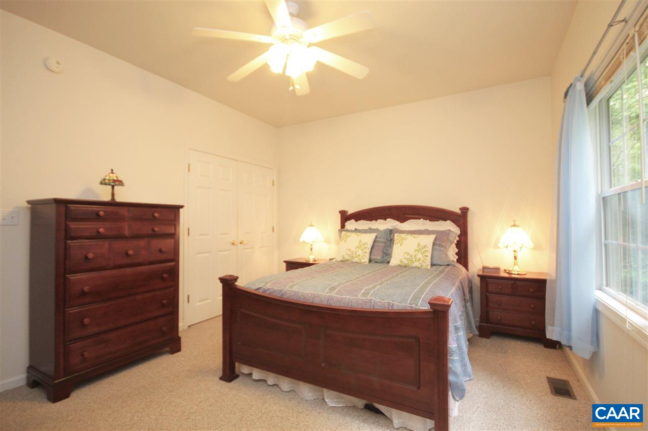 11 Zephyr Road Palmyra, VA 22963 - Photo 13 of 21 a bedroom with a bed and a chandelier