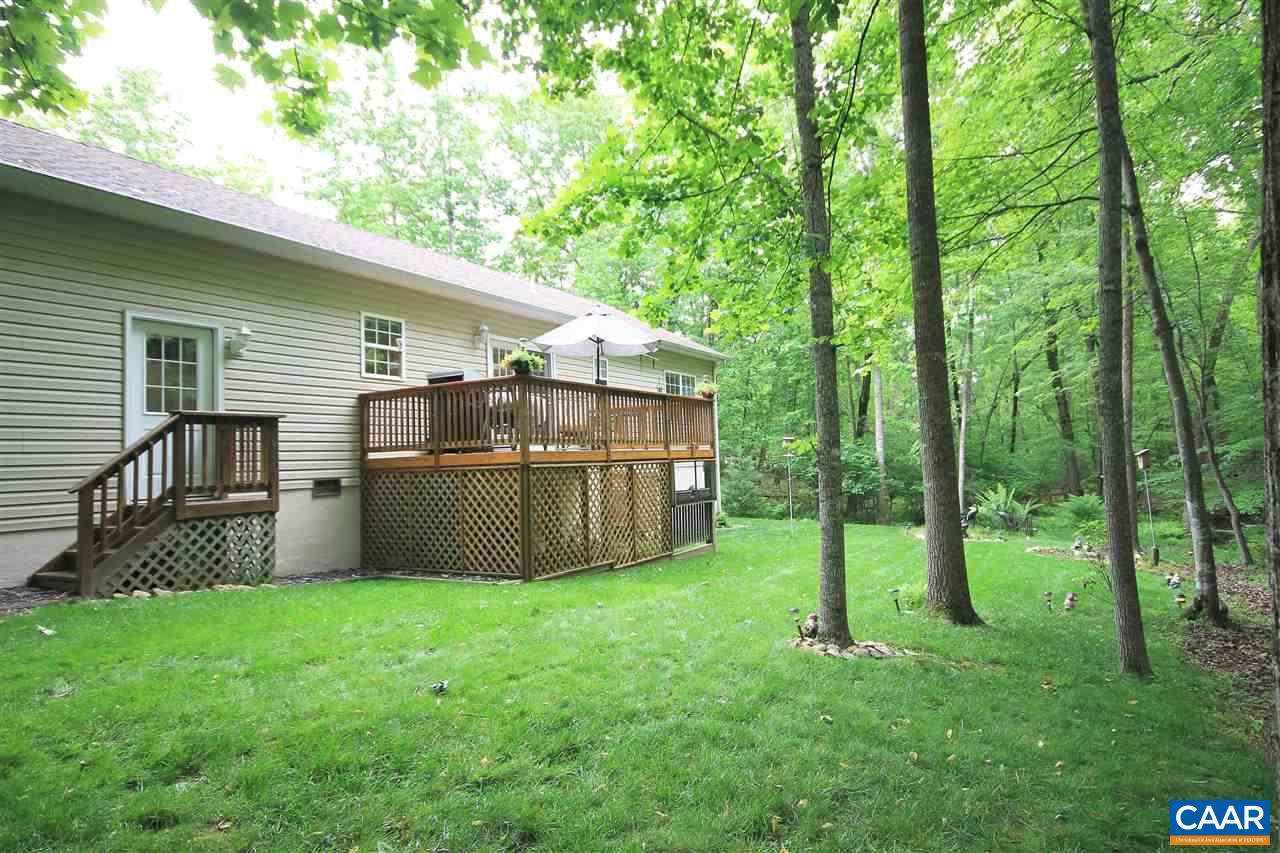 11 Zephyr Road Palmyra, VA 22963 - Photo 18 of 21 a view of a backyard with plants and large trees